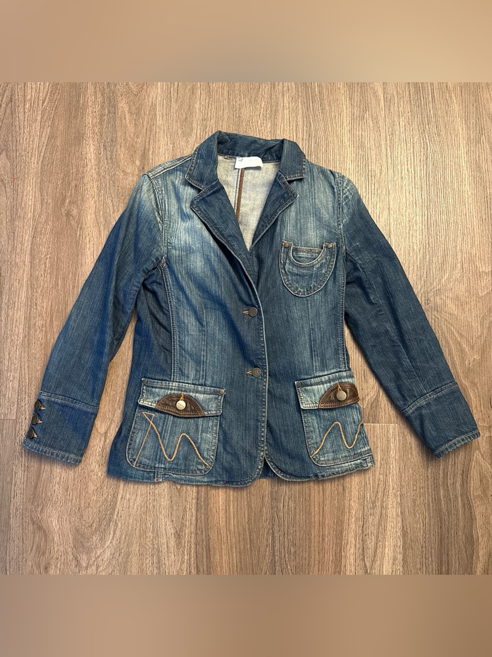Votre Nom Paris 90’s Blue denim jacket with brown leather accents and decorative